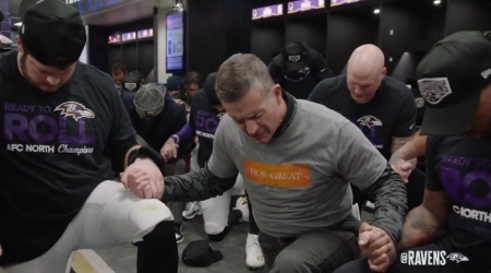 Baltimore Ravens Head Coach John Harbaugh leads his team in the Lord's Prayer as the team faced theCleveland Browns on Jan. 5, 2025.