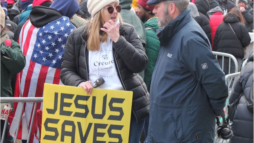 Street preacher Christina Watson stands outside of the Capital One Arena in Washington, D.C., on Jan. 20, 2025. 