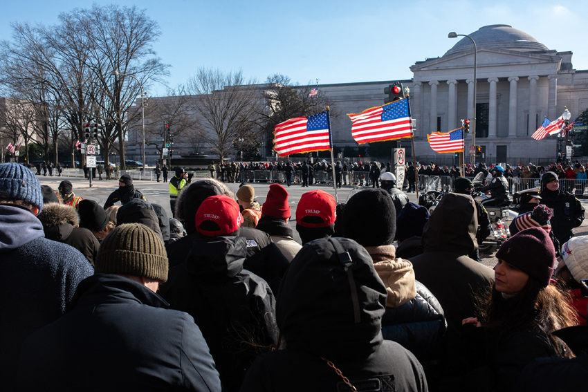 Supporters of Presdient Donald J. Trump wait along Pennsylvania Avenue in Washington, D.C., for a chance to glimpse the president's motorcade on Jan. 20, 2025.