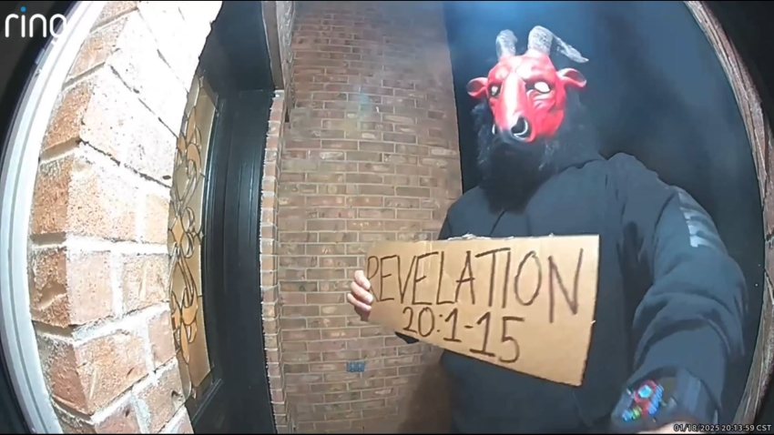 A screenshot of a Ring video showing a goat-masked man on the porch of a North Texas home.