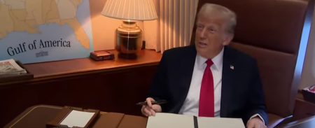 President Donald Trump signs a presidential proclamation recognizing Feb. 9 as "Gulf of America Day" aboard Air Force One on Feb. 9, 2025. 