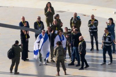 Released hostage Ohad Ben Ami draped in an Israeli flag arrives to Tel Aviv Sourasky Medical Center - Ichilov Hospital by helicopter on February 08, 2025 in Tel Aviv, Israel. On Friday, Hamas informed the Israeli government that it intended to release Or Levy, Eli Sharabi, and Ohad Ben Ami as part of the latest wave of returned hostages, who were taken on Oct. 7, 2023.