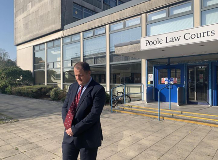 Adam Smith-Connor praying outside the court in Poole where he was convicted.