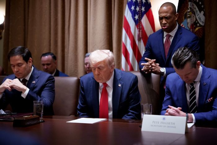 U.S. Secretary of Housing and Urban Development Scott Turner (2nd-R), accompanied by U.S. Secretary of State Marco Rubio (L), U.S. President Donald Trump and U.S. Defense Secretary Pete Hegseth (R), leads a prayer during a cabinet meeting at the White House on Feb. 26, 2025 in Washington, D.C.