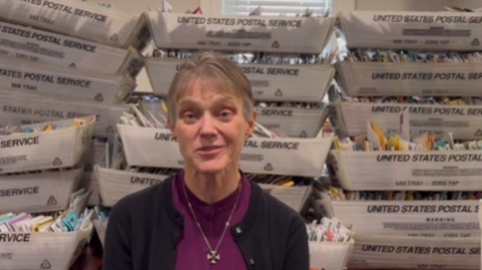 Bishop Mariann Edgar Budde of the Episcopal Diocese of Washington thanks supporters in a Facebook reel uploaded in February 2025 in which a photograph of boxes of letters are seen stacked behind her.