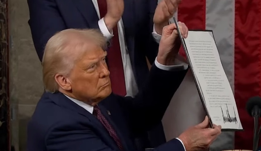 President Donald Trump holds up an executive order renaming the Anahuac National Wildlife Refuge in Texas after Jocelyn Nungaray during his address to a joint session of U.S. Congress on March 4, 2025, in Washington, D.C.
