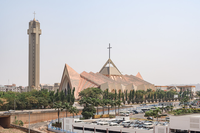 National Ecumenical center, a Christian building for religious ceremonies, in modern architecture style with spiked roof and cross shaped bell tower in Abuja, Federal Capital Territory, Nigeria.