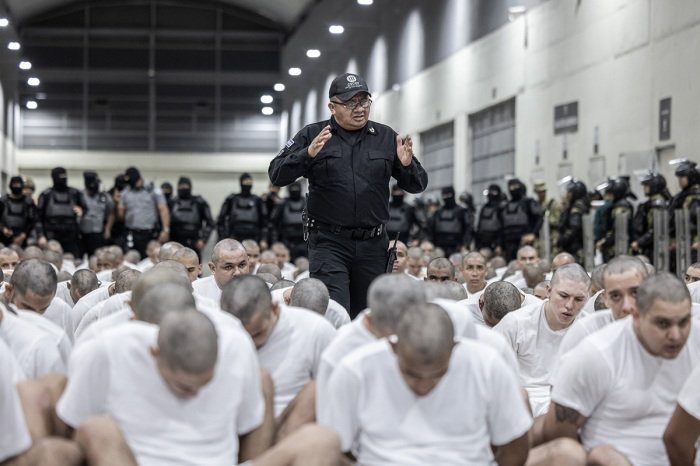 In this handout photo provided by the Salvadoran government, a guard gives directions to the inmates allegedly linked to criminal organizations at CECOT on March 16, 2025, in Tecoluca, El Salvador. Trump's administration deported 238 alleged members of the Venezuelan criminal organizations Tren De Aragua and Mara Salvatrucha with only 23 being members of the Mara. Nayib Bukele, the president of El Salvador, announced that his government will receive the alleged members of the gang to be taken to CECOT. On February of 2023 El Salvador inaugurated Latin America's largest prison as part of President Nayib Bukele's plan to fight gangs.
