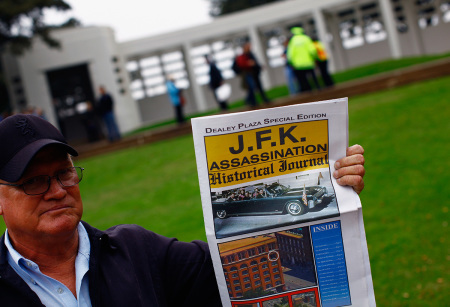 Vendors sell U.S. President John F. Kennedy memorabilia as people visit Dealey Plaza in Dallas, Texas. 