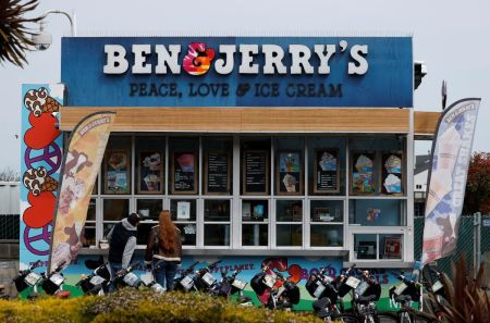 Customers place an order at a Ben and Jerry's ice cream shop on March 19, 2025 in San Francisco, California. Ice cream maker Ben and Jerry's is accusing its parent company, Unilever, of dismissing CEO David Stever for supporting Ben and Jerry's political activism. 