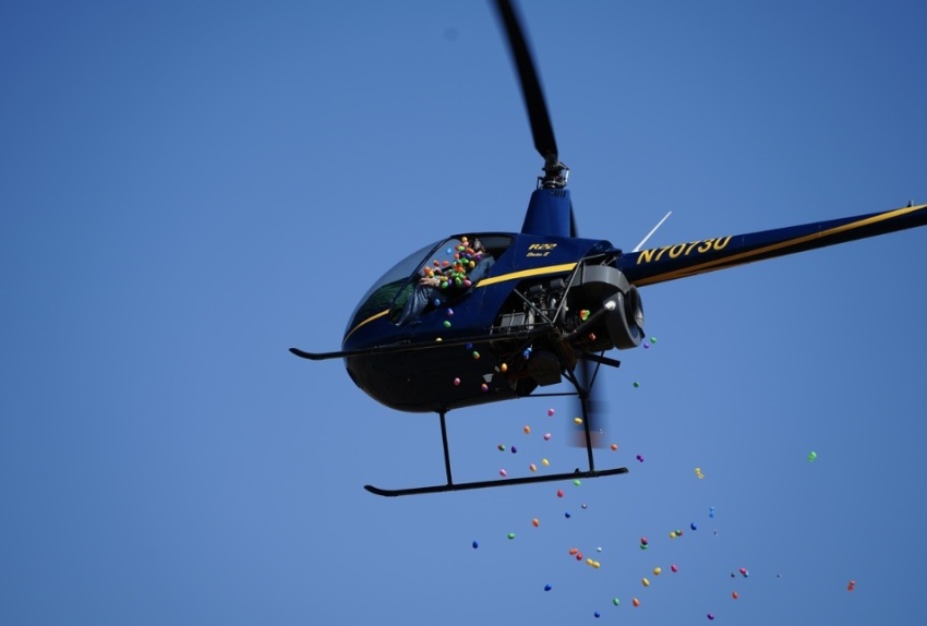 A helicopter drops loads of Easter eggs for an event in 2023 that was organized by Faith Lutheran Church of Aurora, Illinois.