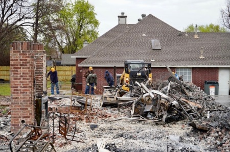 Volunteers with Texans on Mission clean up debris after a wildfire devestated homes in Stillwater, Oklahoma, in March 2025.