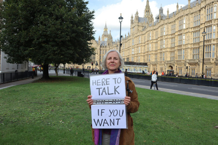 Livia Tossici-Bolt, 62, (R), who held a sign reading “here to talk, if you want to” near an abortion facility in Bournemouth, England.