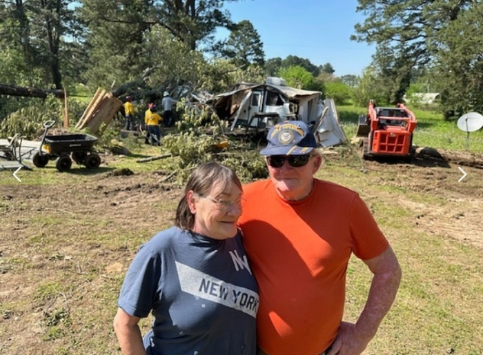 Barbara (L) and Terry (R) Humphrey pose for a photo on their property in Lone Star, Texas, in April 2024.
