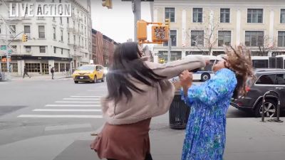 Brianna J. Rivers (L) punches pro-life advocate Savannah Craven Antao (R) during an interview filmed for Live Action in Harlem, New York, on April 3, 2025. 