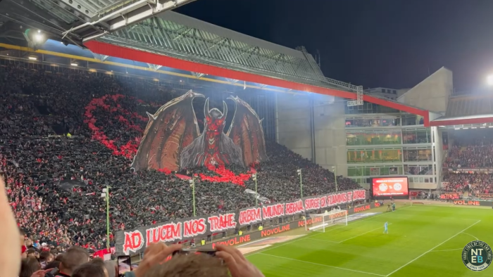A screenshot of a video showing a devil-type image rising from the crowd at a March 29 football match at Fritz Walter Stadium in Kaiserslautern, Germany.