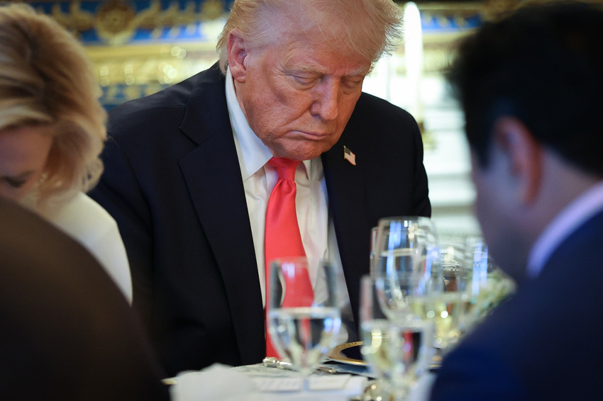 President Donald Trump bows his head in prayer after delivering remarks during an Easter Prayer Service and Dinner in the Blue Room of the White House on April 16, 2025, in Washington, D.C. Christians across the globe will celebrate Easter on Sunday, April 20. 