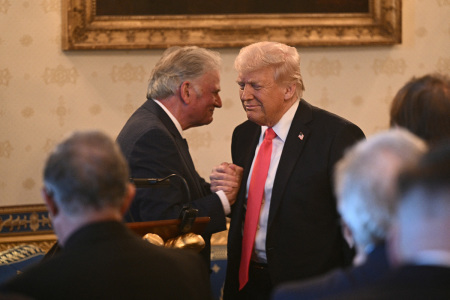The Rev. Franklin Graham shakes hands with U.S. President Donald Trump after addressing an Easter prayer service and dinner in the Blue Room of the White House in Washington, D.C., on April 16, 2025. 