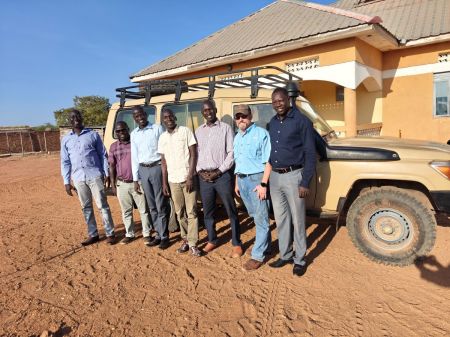 Mitchell Chapman (second from the right) poses for a photo with the staff of South Sudanese on Mission.