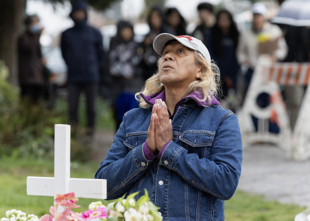 People visit the makeshift memorial near the scene where a car drove into a crowd during the Lapu Lapu Festival on April 28, 2025, in Vancouver, British Columbia. Police detained a 30-year-old man after he drove his car into a crowd at a Filipino street festival on April 26, killing at least 11 people and injuring multiple others.