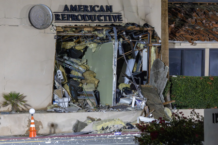 The damaged front of the American Reproductive Centers fertility clinic stands following a bomb blast on May 17, 2025, in Palm Springs, California. A suspected bomber is believed to have post a manifesto to social media before the explosion. One person was confirmed dead at the scene, according to police.