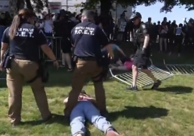 Police make an arrest during a May 24 rally at Cal Anderson Park organized by pro-life group Mayday USA as part of its "#DontMessWithOurKids" national tour, which drew hundreds of supporters and counter-demonstrators. 