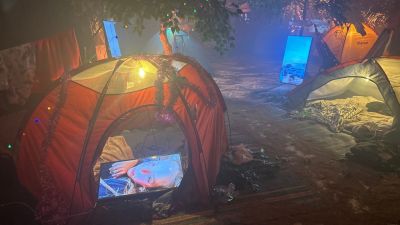 A section of the Nova Music Festival exhibition in Washington, D.C., is intended to represent the campsite where people had set up their stuff before the attack began. 