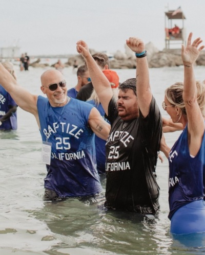 An individual is baptized at Pirates Cove, California as part of the nationwide Baptize America revival event on Sunday, June 8, 2025.