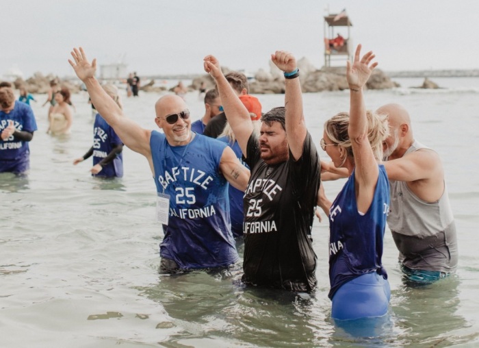An individual is baptized at Pirates Cove, California as part of the nationwide Baptize America revival event on Sunday, June 8, 2025. 
