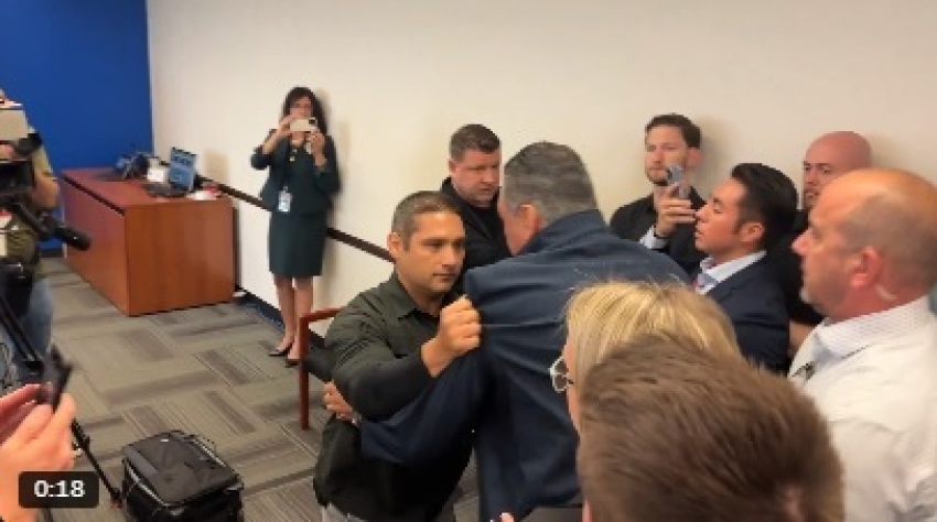 Sen. Alex Padilla, D-Calif., is being removed from the room where U.S. Secretary of Homeland Security Kristi Noem was holding a press conference in Los Angeles amid ongoing riots in the city on June 12, 2025. 