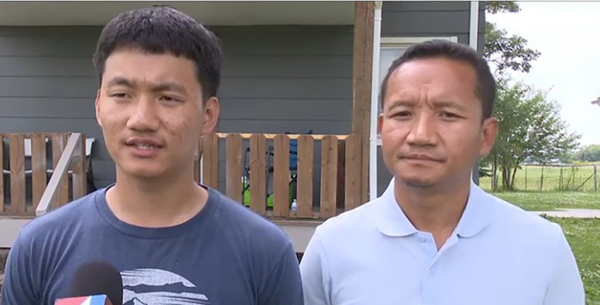 Victor Bawi speaks to the press about his father's church camp. 