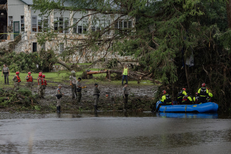 Search and recovery workers dig through debris looking for any survivors or remains of people swept up in the flash flooding at Camp Mystic on July 6, 2025, in Hunt, Texas. Heavy rainfall caused flooding along the Guadalupe River in central Texas with multiple fatalities reported. 