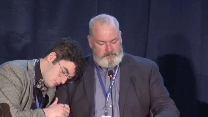 Simon Amaya Price, left, hugs his father Gareth Amaya Price as he chokes up during the Federal Trade Commission's workshop on gender-affirming care for minors on Jul. 9, 2025, in Washington, D.C.