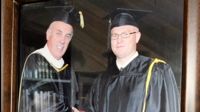 James Coates, the first pastor to be jailed in Canada during the COVID-19 pandemic, shakes hands with Pastor John MacArthur upon his 2010 graduation from The Master's Seminary in Los Angeles, California.
