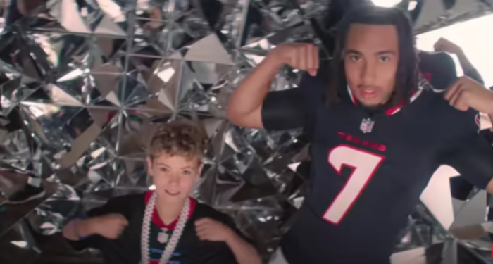 John Herring, a 12-year-old with a chronic heart condition, poses with Houston Texans quarterback C.J. Stroud, whom he got to meet as part of a partnership between ESPN and the Make-a-Wish Foundation. 