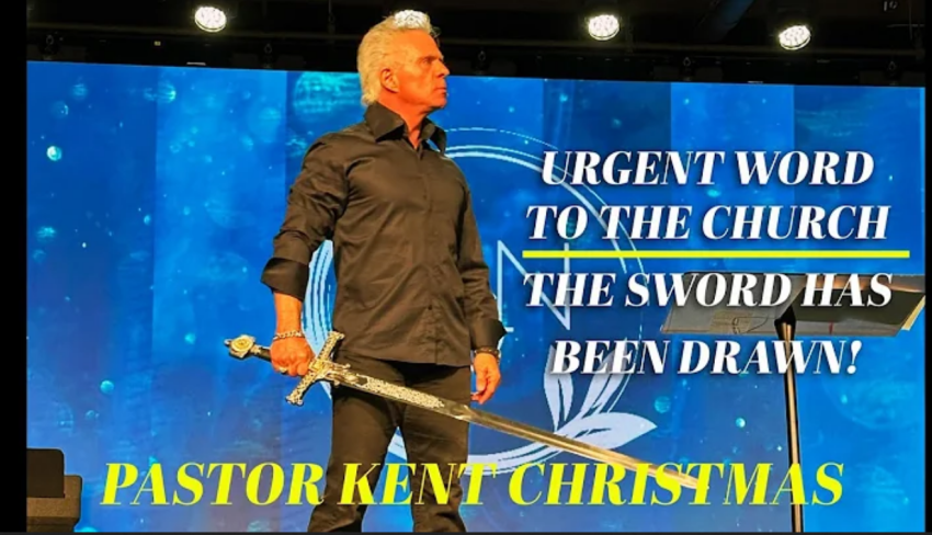 Pastor Kent Christmas of Regeneration Nashville stands with a sword in his hand during a sermon July 20, 2025.