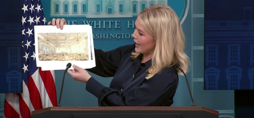 White House Press Secretary Karoline Leavitt holds up renderings of the planned White House State Ballroom at a White House press briefing, July 31, 2025. 