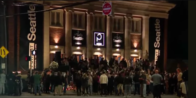Mourners gather outside The Pursuit Church in Seattle, Washington to remember slain congregant LeBron Givaun, August 3, 2025. 