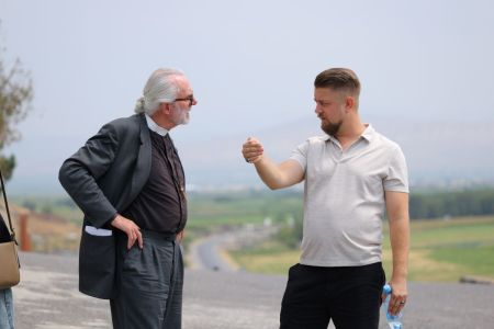 Bill Devlin (left) speaks with Matias Perttula (right) during the American Christian delegation trip to Armenia on July 29, 2025. 