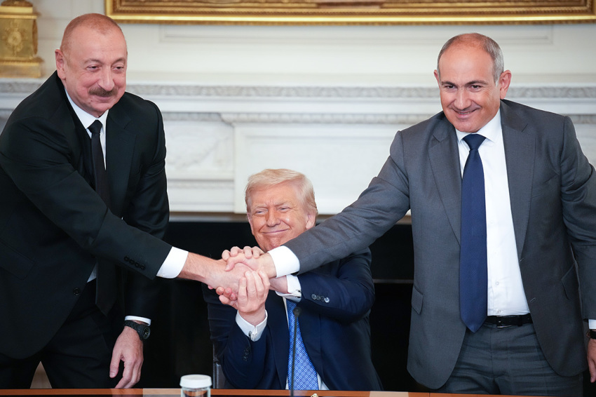 U.S. President Donald Trump (C) joins hands with Azerbaijani President Ilham Aliyev (L), and Armenian Prime Minister Nikol Pashinyan (R) during a signing ceremony in the State Dining Room of the White House on Aug. 8, 2025, in Washington, D.C. The signed agreement is intended to bring an end to the conflict between Armenia and Azerbaijan that has lasted for decades.