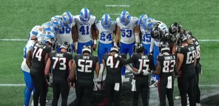Players with the Detroit Lions and Atlanta Falcons gather on the field in prayer following the injury of Lions cornerback Morice Norris during a preseason game in Atlanta, Georgia, on Aug. 8, 2025.