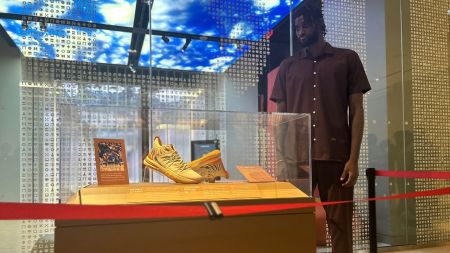 Orlando Magic forward Jonathan Isaac celebrates the debut of a signed pair of Judah 1 sneakers being displayed at the Museum of the Bible in Washington, D.C., on Aug. 19, 2025. The shoes are made by Isaac's Christian apparel brand UNITUS. 