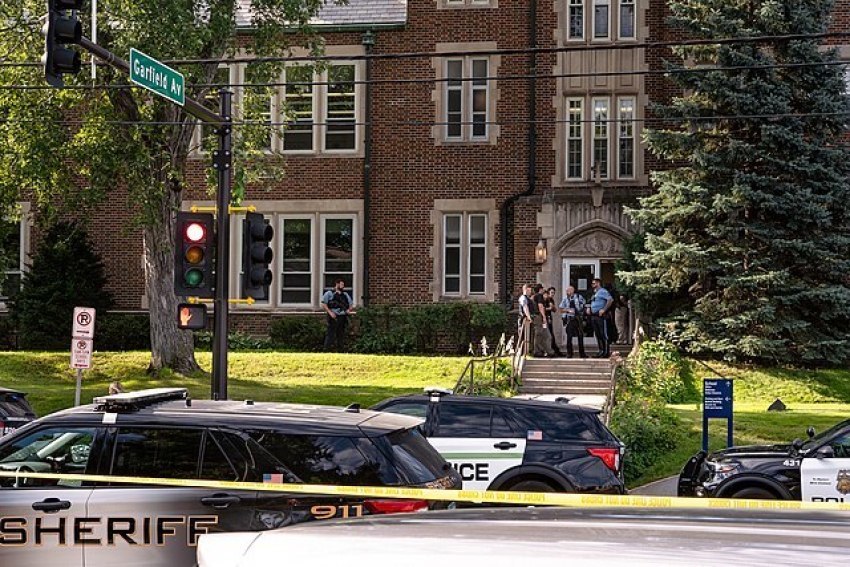 Police gather at Annunciation Catholic School in Minneapolis, Minnesota, on Aug. 27, 2025, following a mass shooting that killed two children and injured several others. 