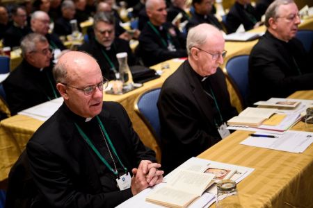 Members of the Catholic church say a prayer during an opening session of the annual U.S. Conference of Catholic Bishops on Nov.r 12, 2018, in Baltimore, Maryland.