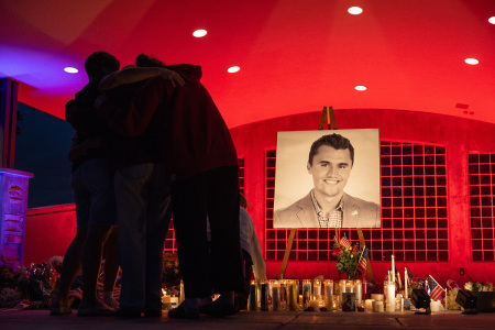 People pay their respects during a candlelight vigil for Christian youth activist and influencer Charlie Kirk at a makeshift memorial at Orem City Center Park in Orem, Utah, a day after he was shot during a public event at Utah Valley University on Sept. 11, 2025. Kirk, a 31-year-old superstar who was credited with helping Donald Trump return to the presidency last year, was shot while addressing a large crowd at Utah Valley University on Wednesday. 