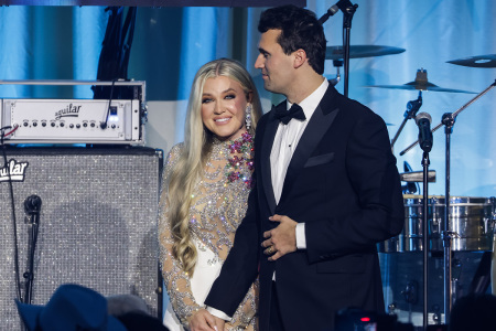 Charlie Kirk (R) and and his wife. Erika Lane Frantzve, (L) on stage during the Turning Point USA Inaugural-Eve Ball at the Salamander Hotel on Jan. 19, 2025, in Washington, D.C.
