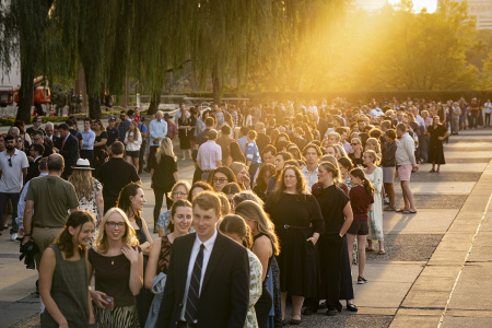 People wait in line prior to a prayer vigil for political activist Charlie Kirk outside the John F. Kennedy Center for the Performing Arts on Sept. 14, 2025, in Washington, D.C. Kirk was shot and killed by a gunman on Sept. 10 while speaking at Utah Valley University. 