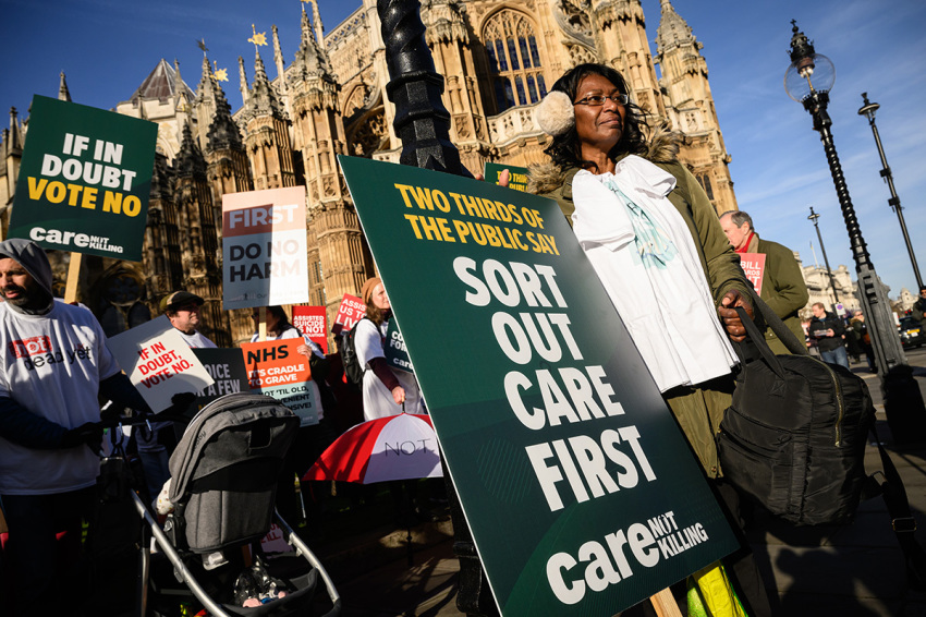 Supporters of the "Not Dead Yet" campaign, which opposes the Assisted Dying Bill, protest outside the Houses of Parliament on Nov. 29, 2024, in London, England.