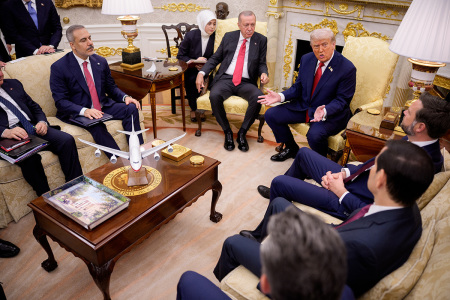 President Donald Trump, accompanied by President of Turkey Recep Tayyip Erdogan (C), speaks during a meeting in the Oval Office at the White House on Sept. 25, 2025, in Washington, D.C. Trump has signaled that the U.S. might lift a ban on F-35 sales to Turkey during Erdogan's first visit to the White House since 2019. 