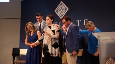 Pastor Rob Pacienza prays over the participants of CP's 